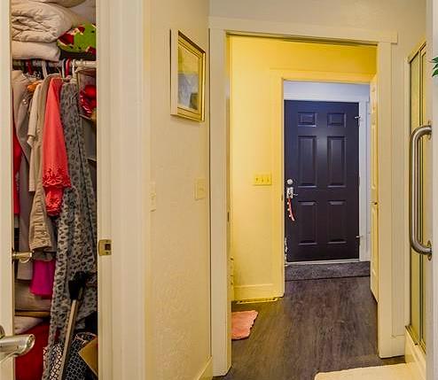 interior space with dark wood-style floors and baseboards