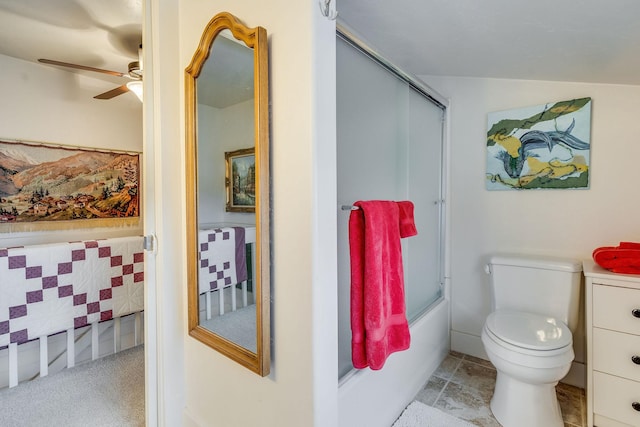 bathroom with toilet, ceiling fan, and bath / shower combo with glass door