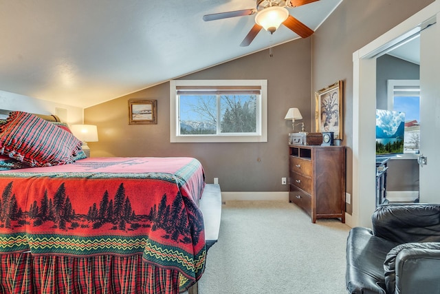 bedroom featuring a ceiling fan, vaulted ceiling, carpet, and baseboards