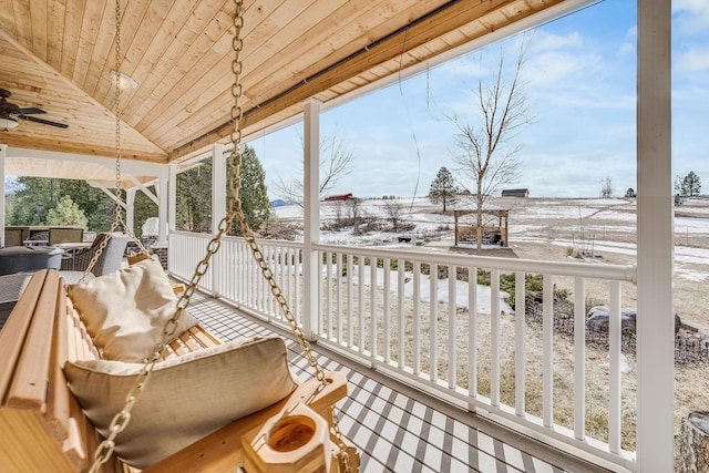 snow covered deck with a ceiling fan