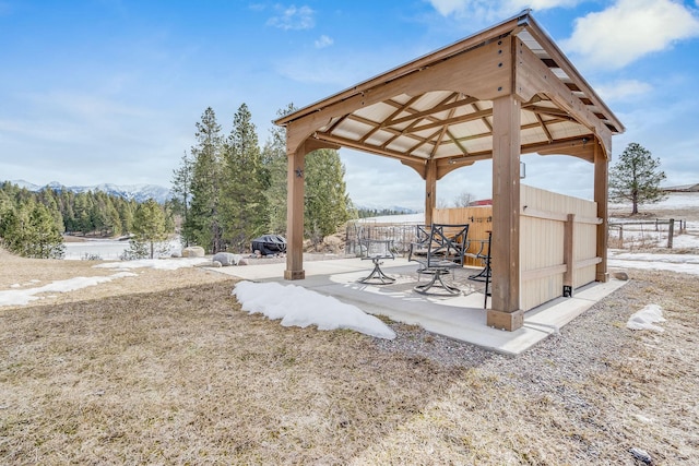 surrounding community with a gazebo and a patio