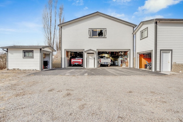 exterior space featuring an outbuilding and a garage