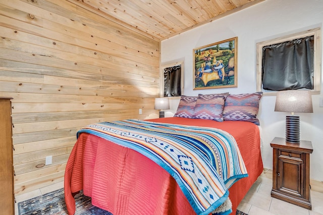 bedroom featuring tile patterned flooring, wood walls, and wood ceiling