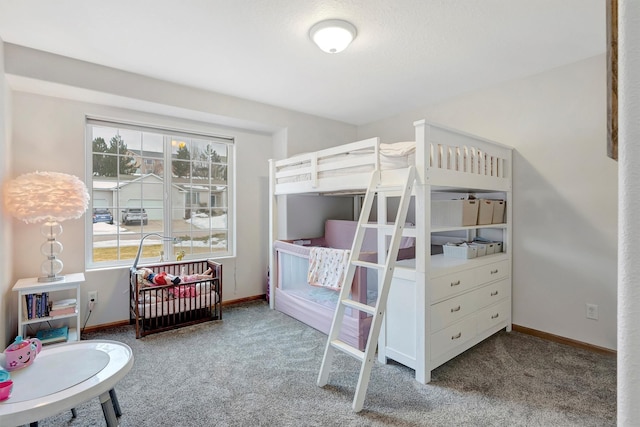 bedroom with carpet and baseboards