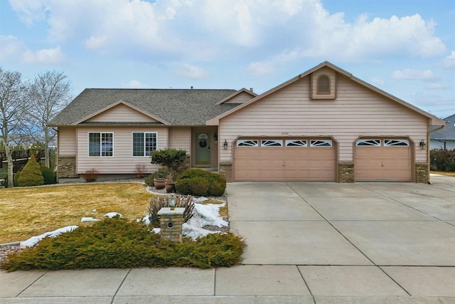 ranch-style house featuring a garage, brick siding, driveway, roof with shingles, and a front yard