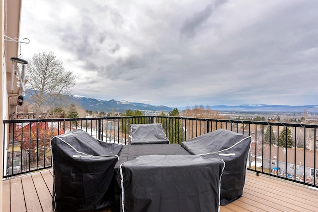 wooden deck with a mountain view