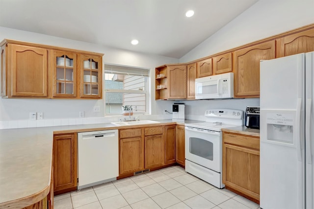 kitchen with light tile patterned floors, glass insert cabinets, vaulted ceiling, a sink, and white appliances