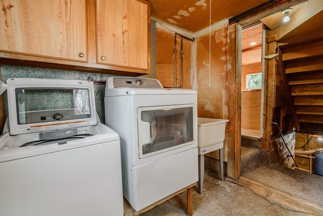 13195 US Highway 91 N, Conrad, MT 59425 - laundry room featuring separate washer and dryer and cabinet space