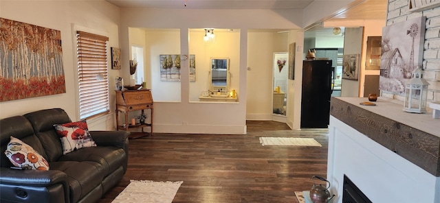 living room featuring baseboards and wood finished floors