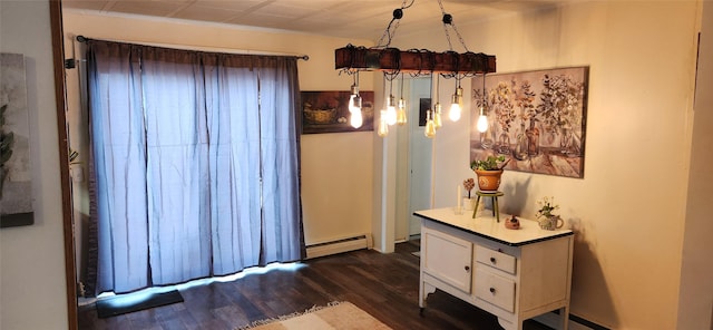 interior space with a baseboard heating unit, ornamental molding, and dark wood-style floors