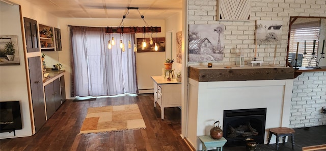 bar featuring dark wood-style floors, a baseboard radiator, and a fireplace