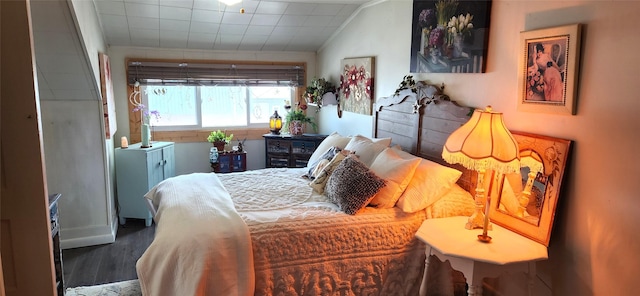 bedroom with wood finished floors