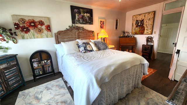 bedroom with wood finished floors