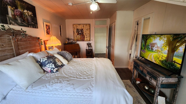 bedroom with a closet, wood finished floors, and wood ceiling