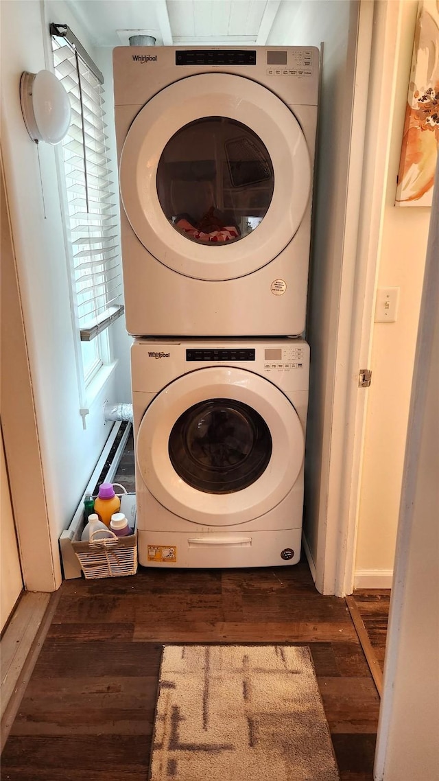 washroom with laundry area, wood finished floors, and stacked washer and clothes dryer