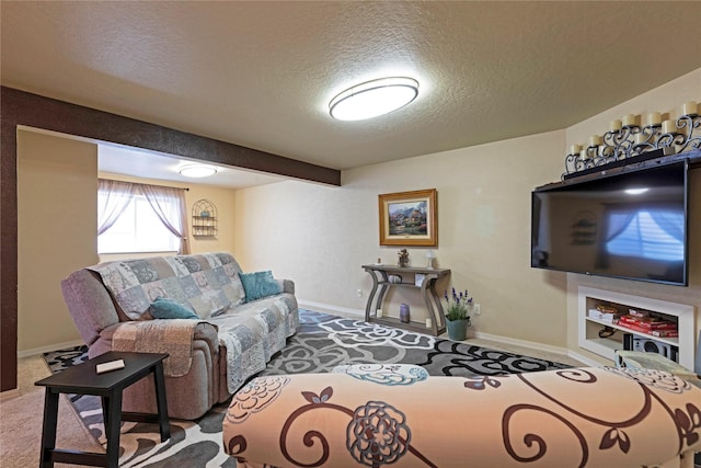 living room with a textured ceiling, carpet, and baseboards