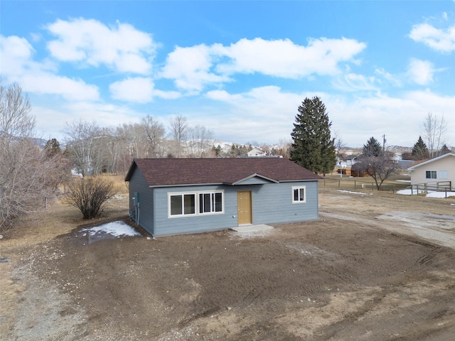 view of front of home with a shingled roof