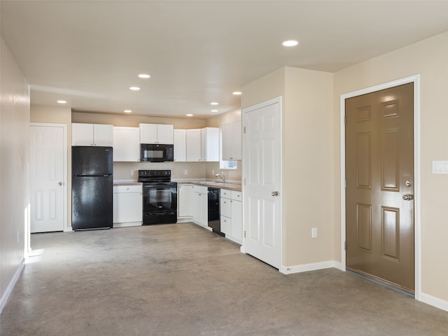 kitchen featuring black appliances, recessed lighting, light countertops, and white cabinets