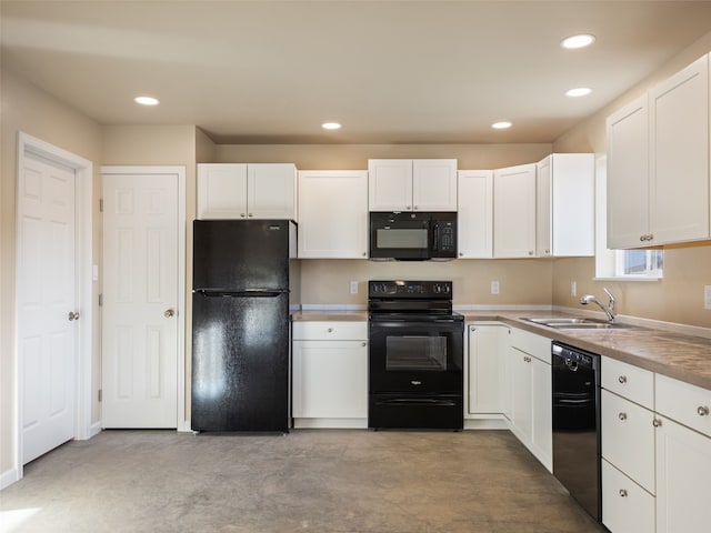 kitchen featuring white cabinets, black appliances, concrete floors, a sink, and recessed lighting