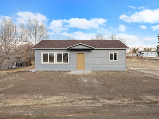 view of front of house with a shingled roof