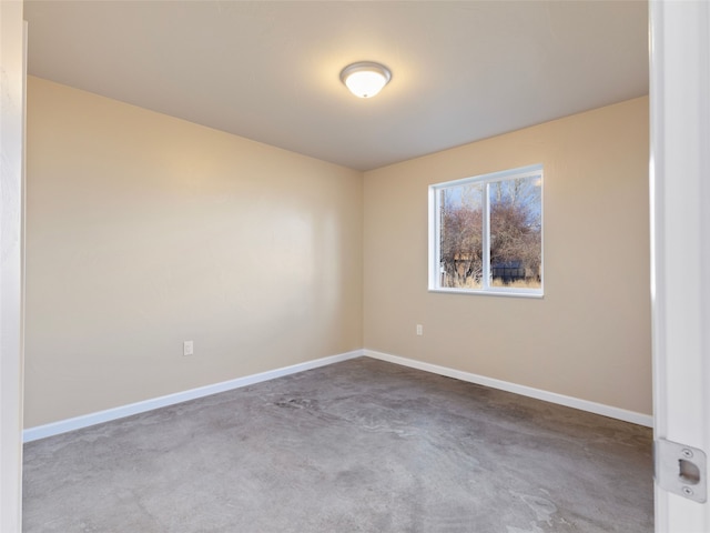 empty room featuring baseboards