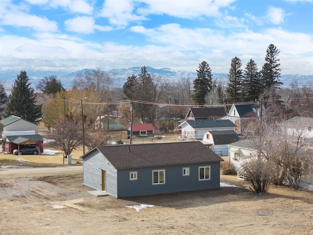 birds eye view of property featuring a mountain view