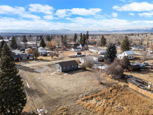 drone / aerial view featuring a residential view and a mountain view