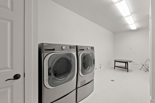 laundry room featuring laundry area, visible vents, and washer and dryer