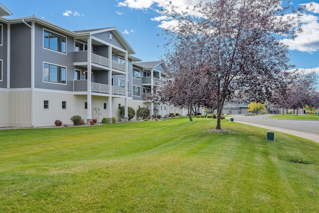 view of property's community with a lawn