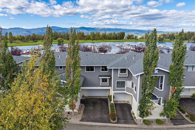 bird's eye view featuring a water and mountain view