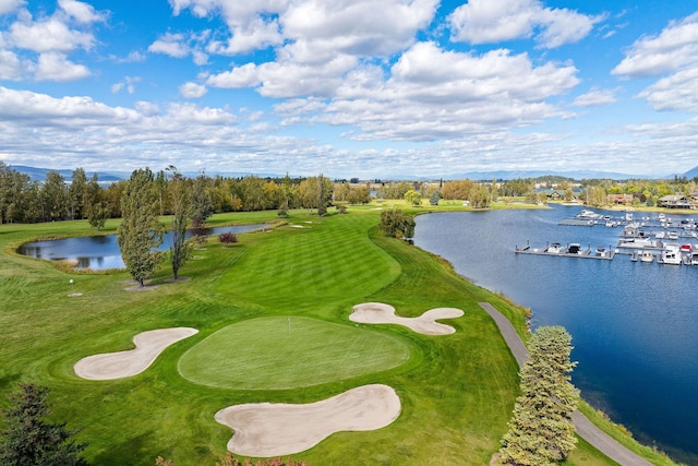 birds eye view of property featuring a water view and golf course view