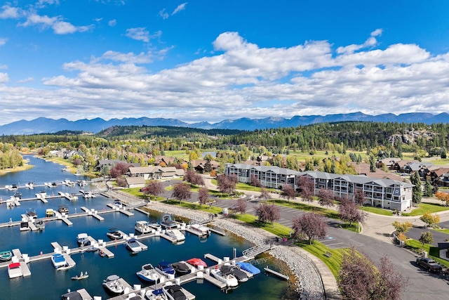 drone / aerial view featuring a water and mountain view