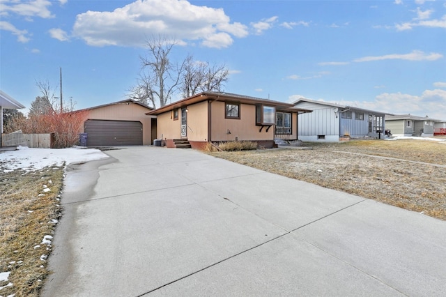 view of front of house featuring an outbuilding, a garage, and entry steps