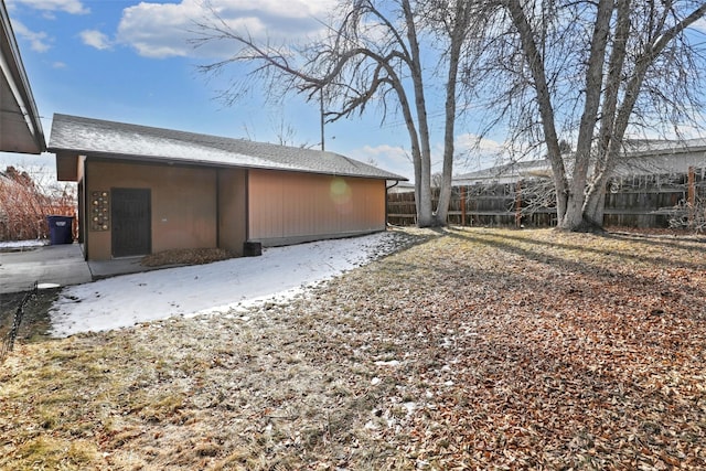 back of property featuring fence