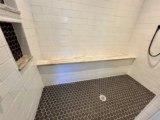 bathroom featuring tiled shower