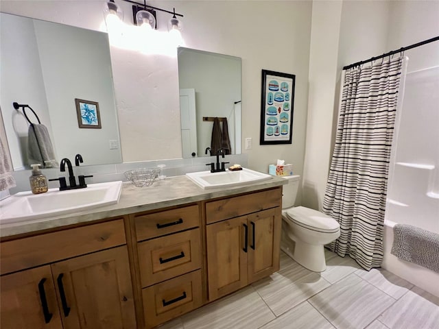 full bathroom with shower / bath combination with curtain, a sink, toilet, and double vanity