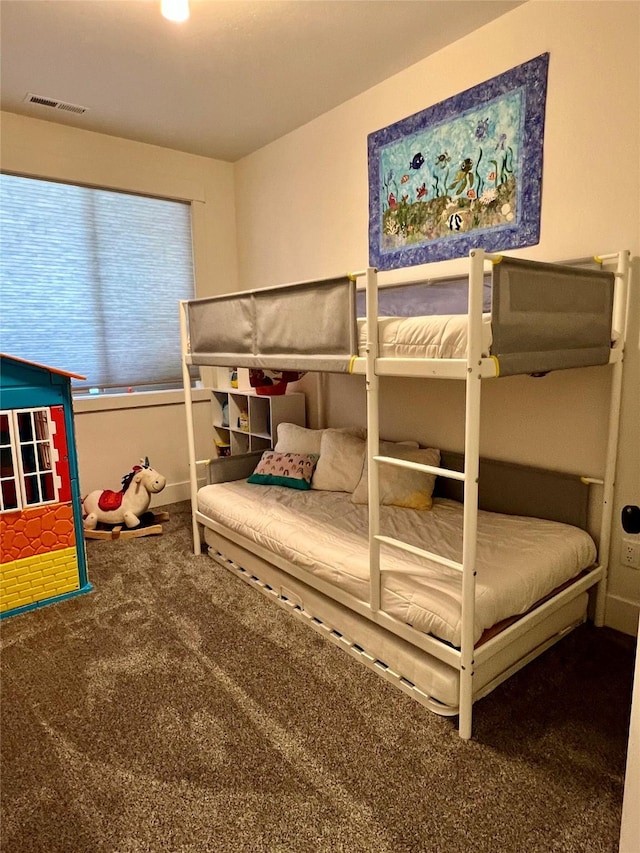 bedroom featuring carpet flooring and visible vents