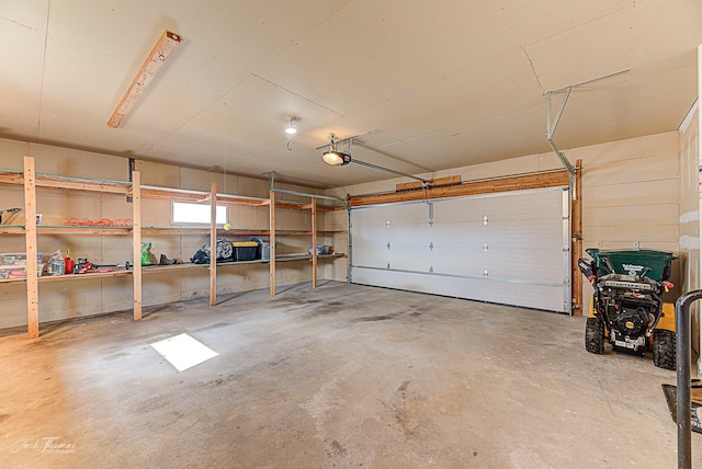 garage featuring a garage door opener