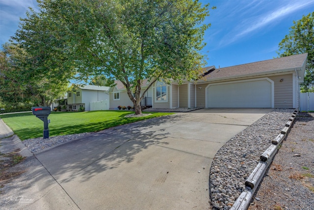 single story home with a garage, concrete driveway, and a front lawn