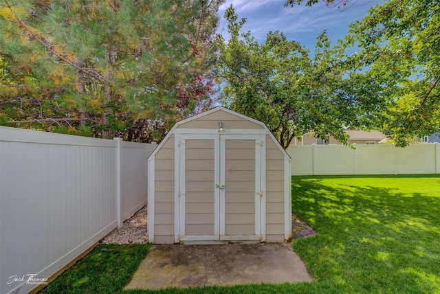 view of shed featuring a fenced backyard