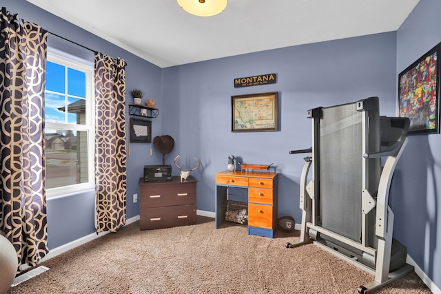 carpeted home office featuring visible vents and baseboards