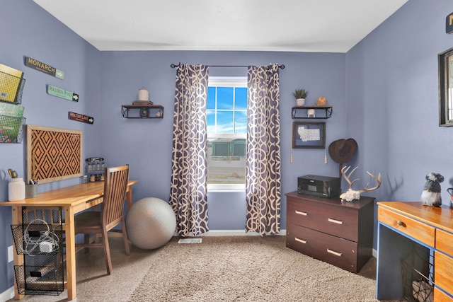 office area featuring carpet and baseboards