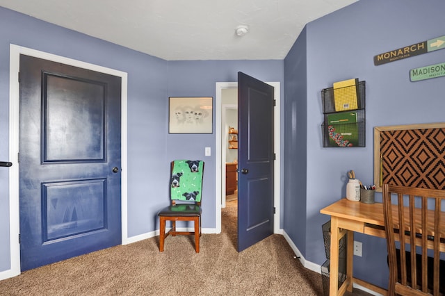 bedroom with carpet floors and baseboards