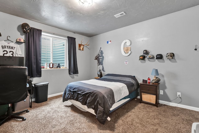 bedroom featuring carpet floors, visible vents, and baseboards