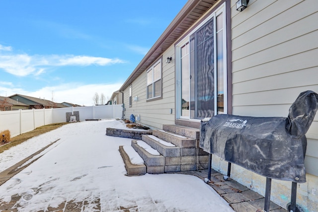 exterior space featuring entry steps and a fenced backyard