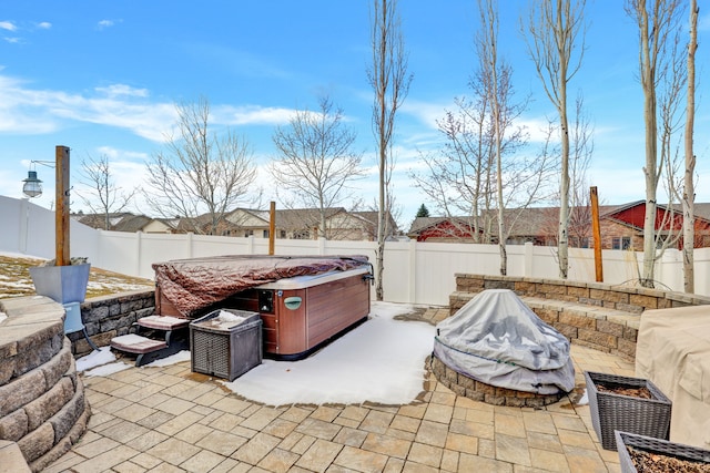 view of patio featuring a fenced backyard and a hot tub