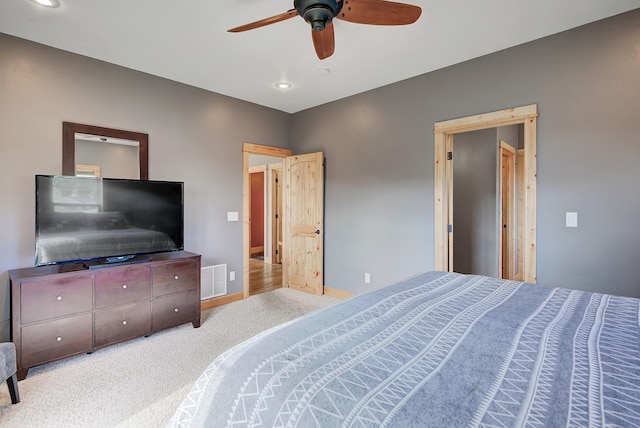 bedroom featuring baseboards, visible vents, ceiling fan, and carpet flooring