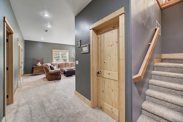 interior space with carpet floors, recessed lighting, visible vents, and baseboards