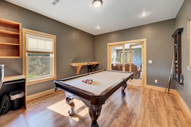 playroom with french doors, wood finished floors, visible vents, and baseboards