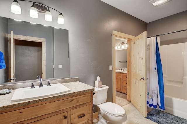 full bathroom with shower / bath combination with curtain, vanity, and toilet